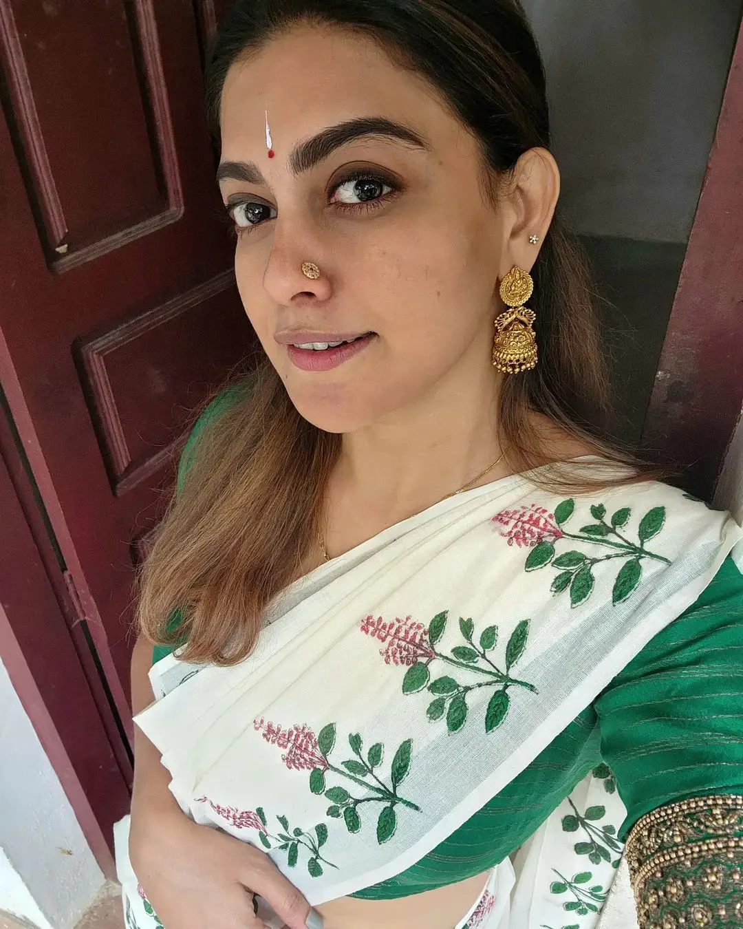 Anusree Nair Wearing Beautiful Earrings Jewellery White Saree Green Blouse